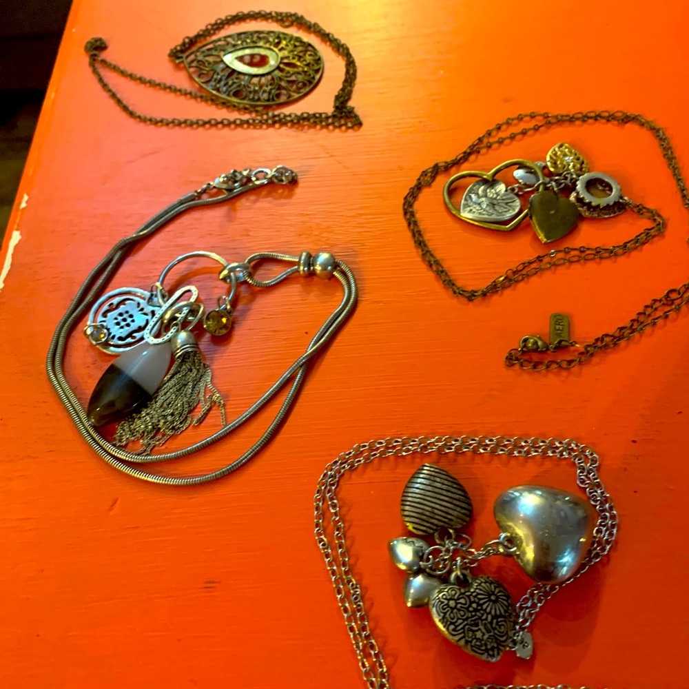 Four necklaces with charms